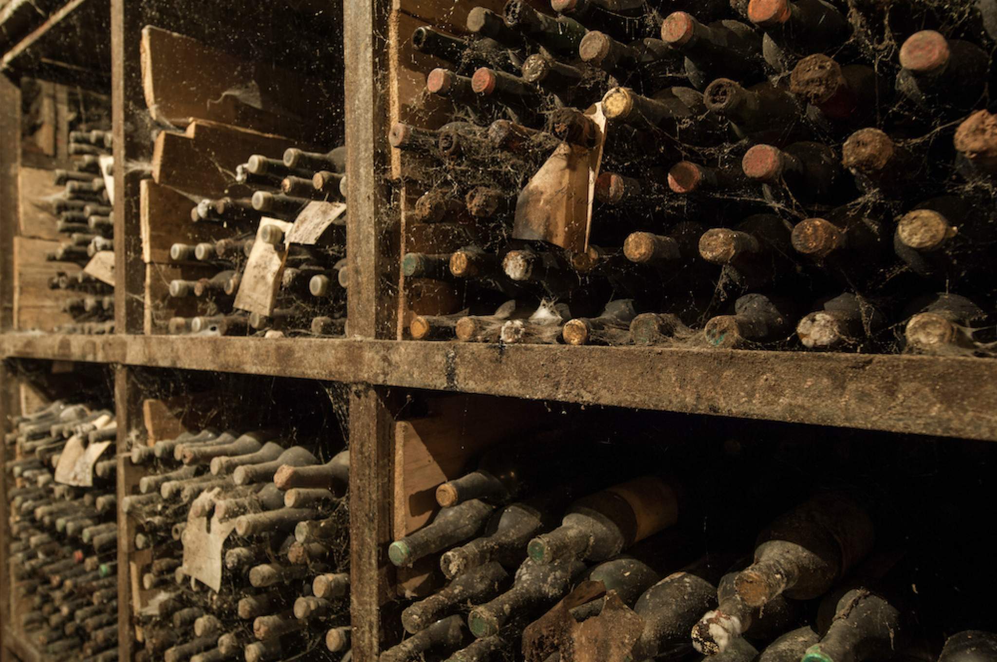 lot-old-wine-bottles-web-wine-cellar-shelves.jpg